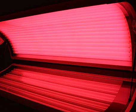 Red light therapy bed at Tropitana Tanning salon Delafield WI